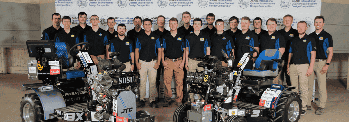 Photo of the team with the tractors