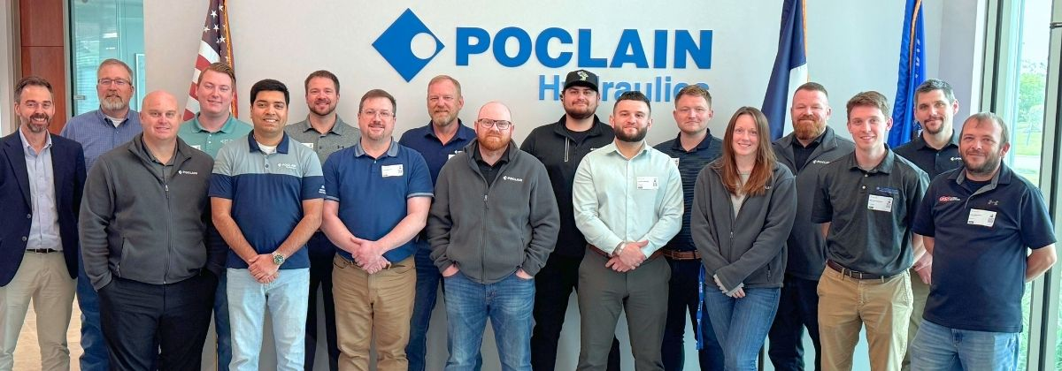 Picture of the group of Poclain experts and distributors