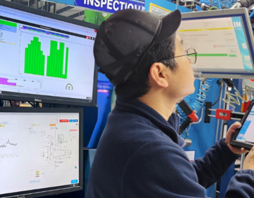 An operator working in front of a computer machine