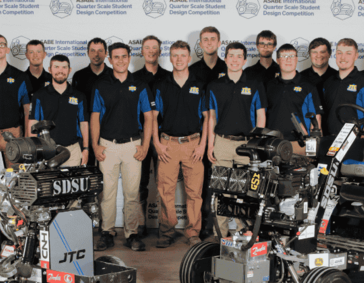 Photo of the team with the tractors