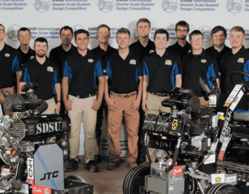 Photo of the team with the tractors