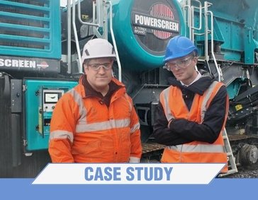 Picture of Terex and Poclain experts in front of a jaw crusher