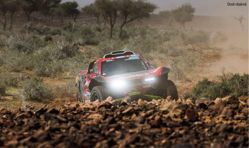 Dakar buggy racing on a rocky terrain
