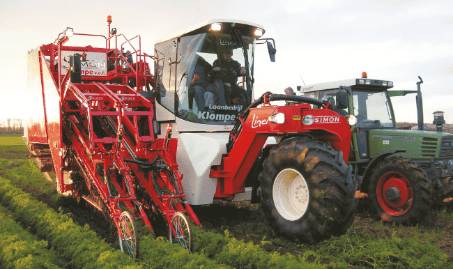 Picture of a Poclain equiped carrot harvester