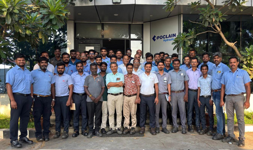 group picture in front of Poclain India