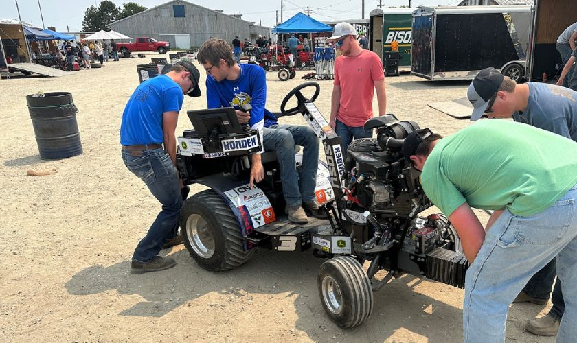 The team checking the tractor
